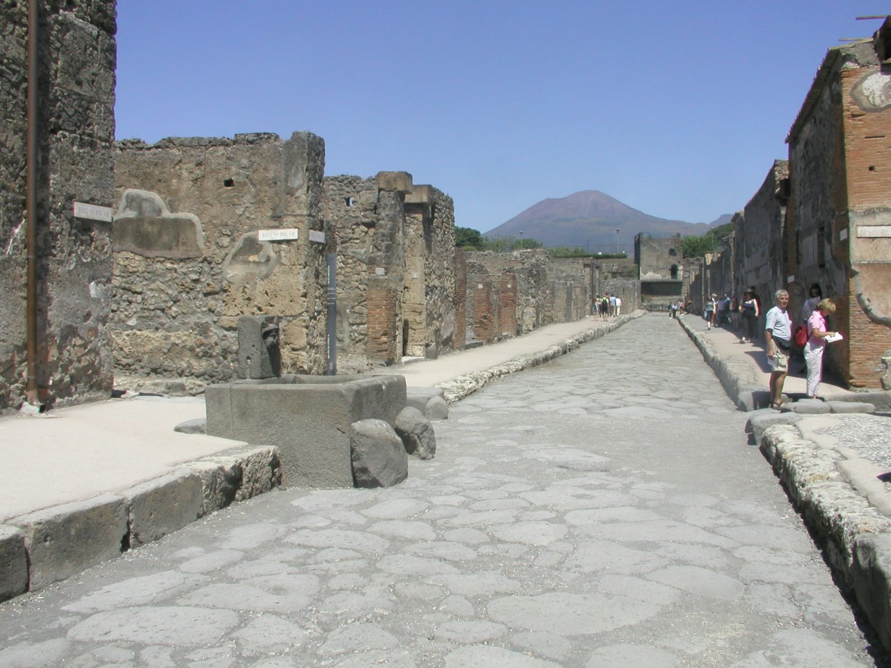 JPEG image - Pompei : One of the many excavated roads - with the ever present threat of Vesuvius in the background. ...
