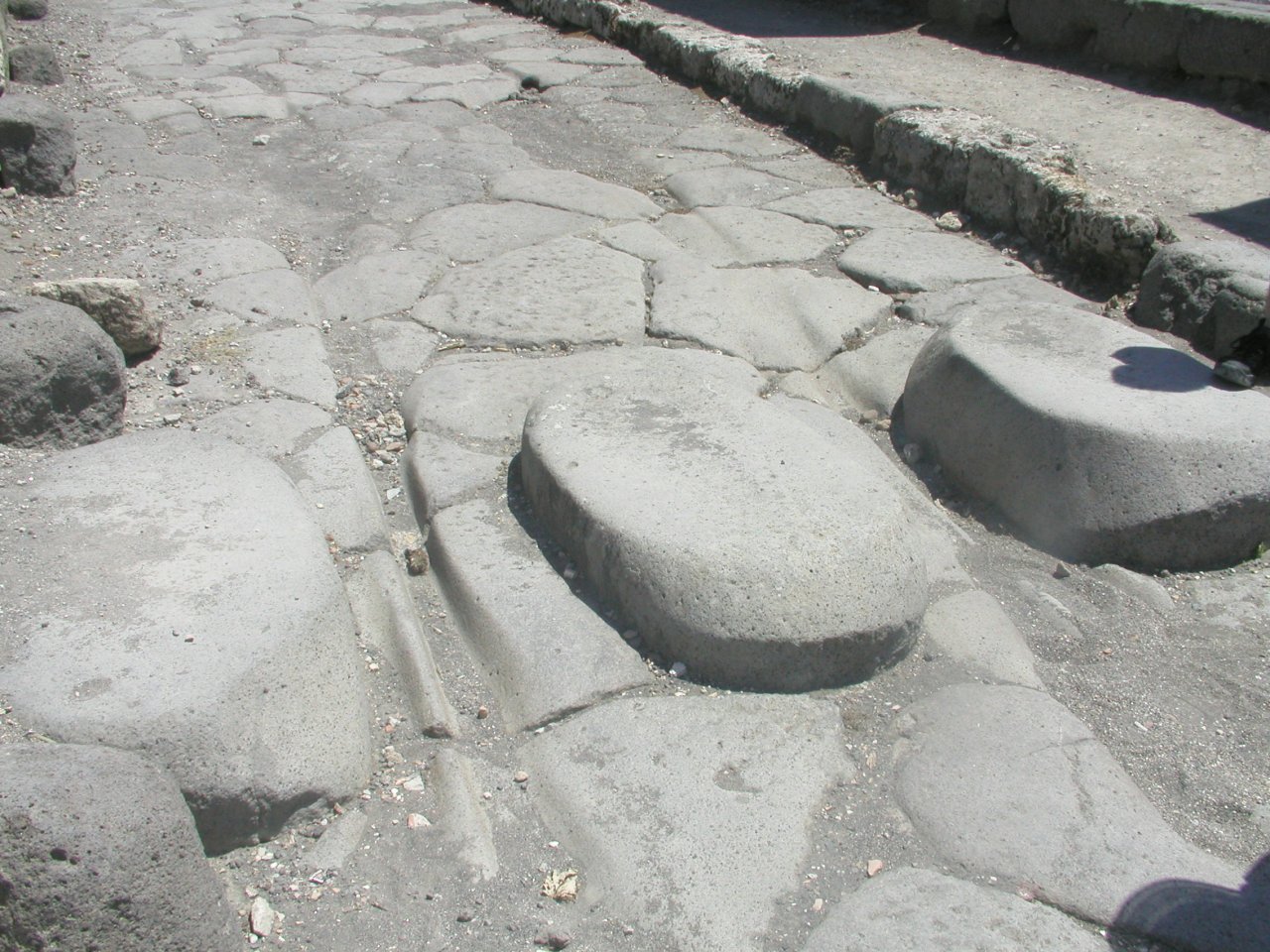 JPEG image - Pompei : the ruts made by cart wheels are very evident in some places on the roads. ...