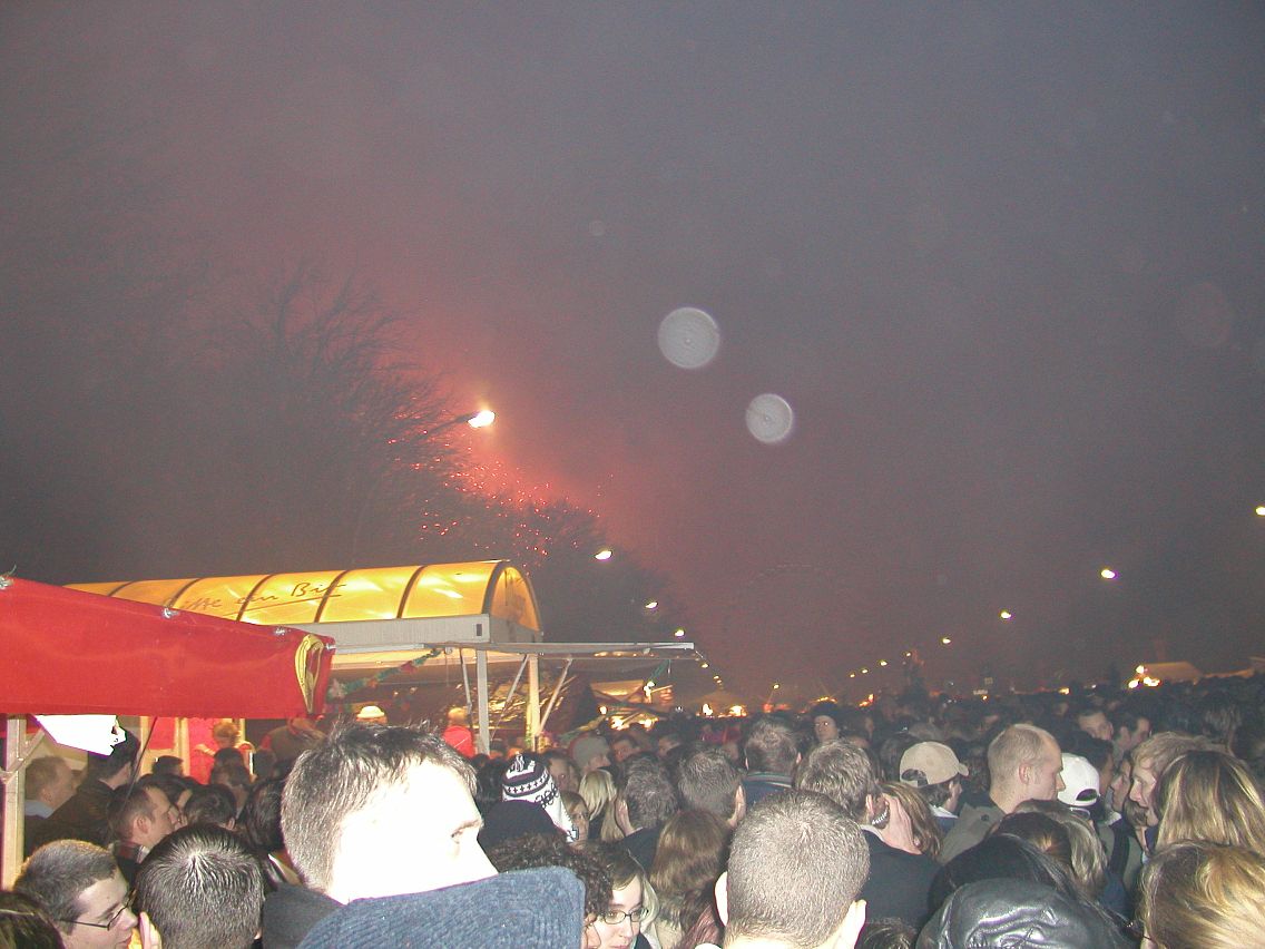 JPEG image - Looking towards the Siegessule: fireworks, smoke & ferris wheel. ...