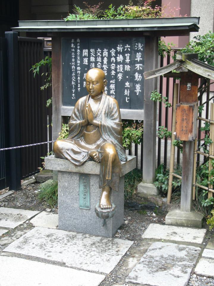 JPEG image - It was difficult to get a picture of this statuette: people kept going to it and rubbing parts of it. ...