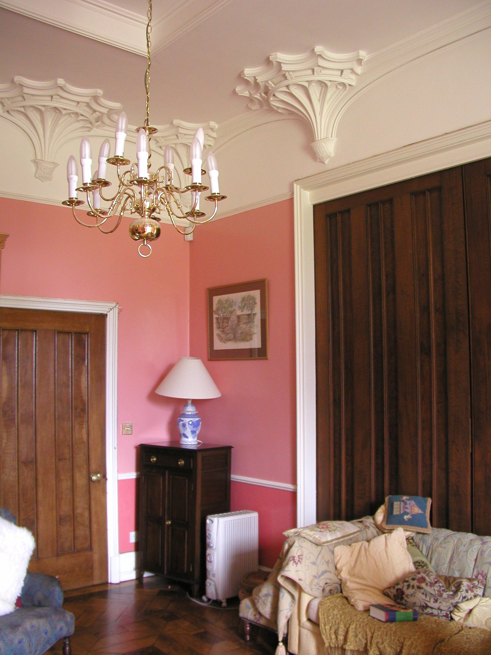 JPEG image - A smaller sitting room, with a lovely hardwood floor and more fancy ceiling plasterwork 