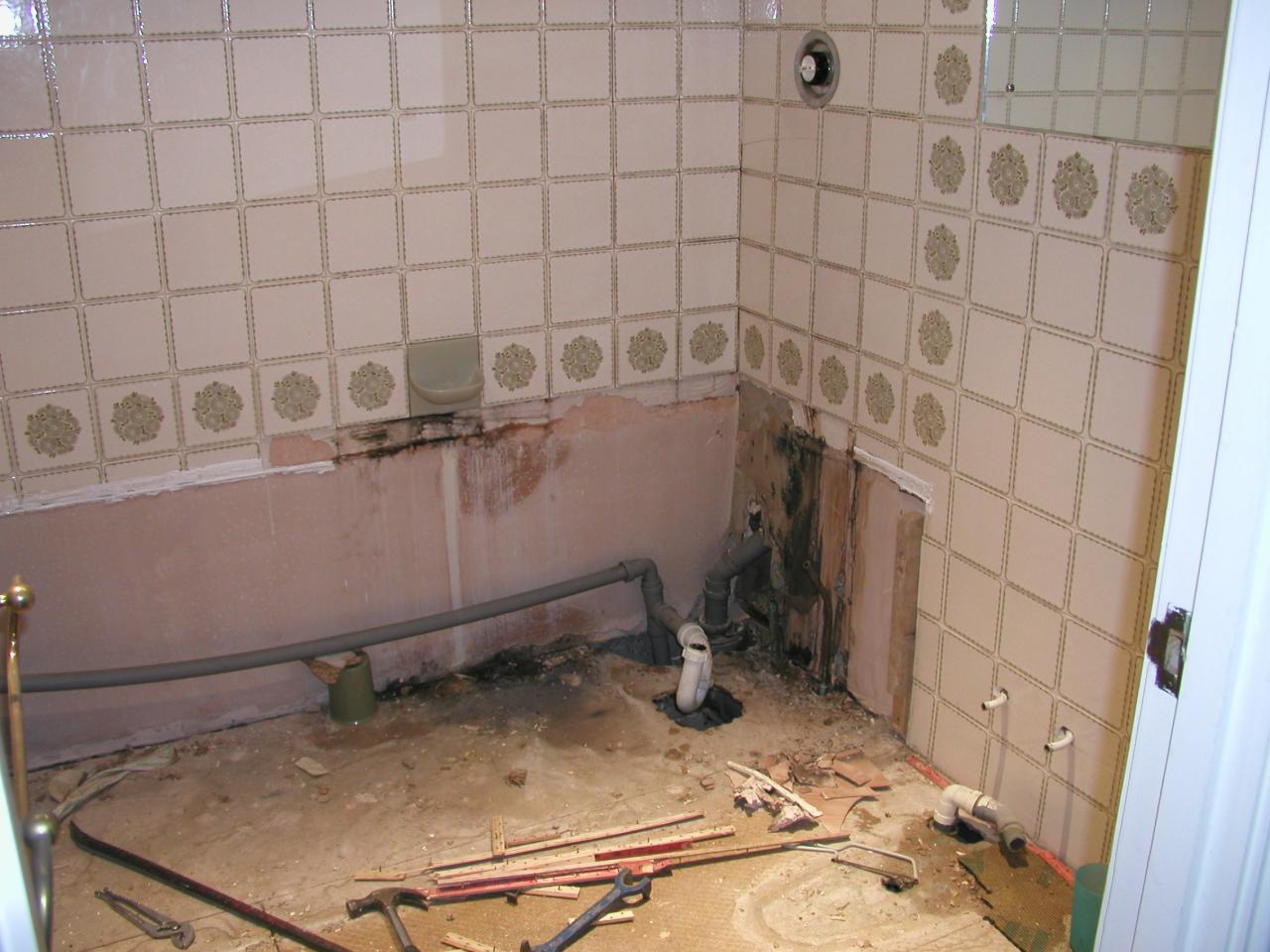 JPEG image - Having removed the bath, the reason for the peeling wallpaper in the room below can be seen! ...