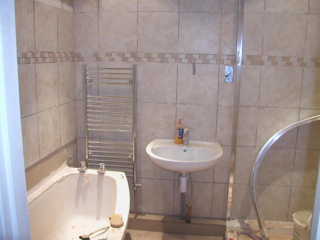 JPEG image - Basin & towel rail fixed and plumbed in, pipework boxed in ...