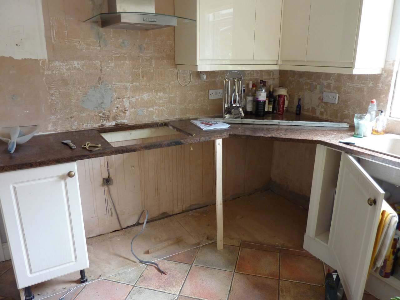 JPEG image - New corner wall cupboards installed, and some base units removed. Note the end unit left supporting the very heavy granite top until the other units can take over the support! ...