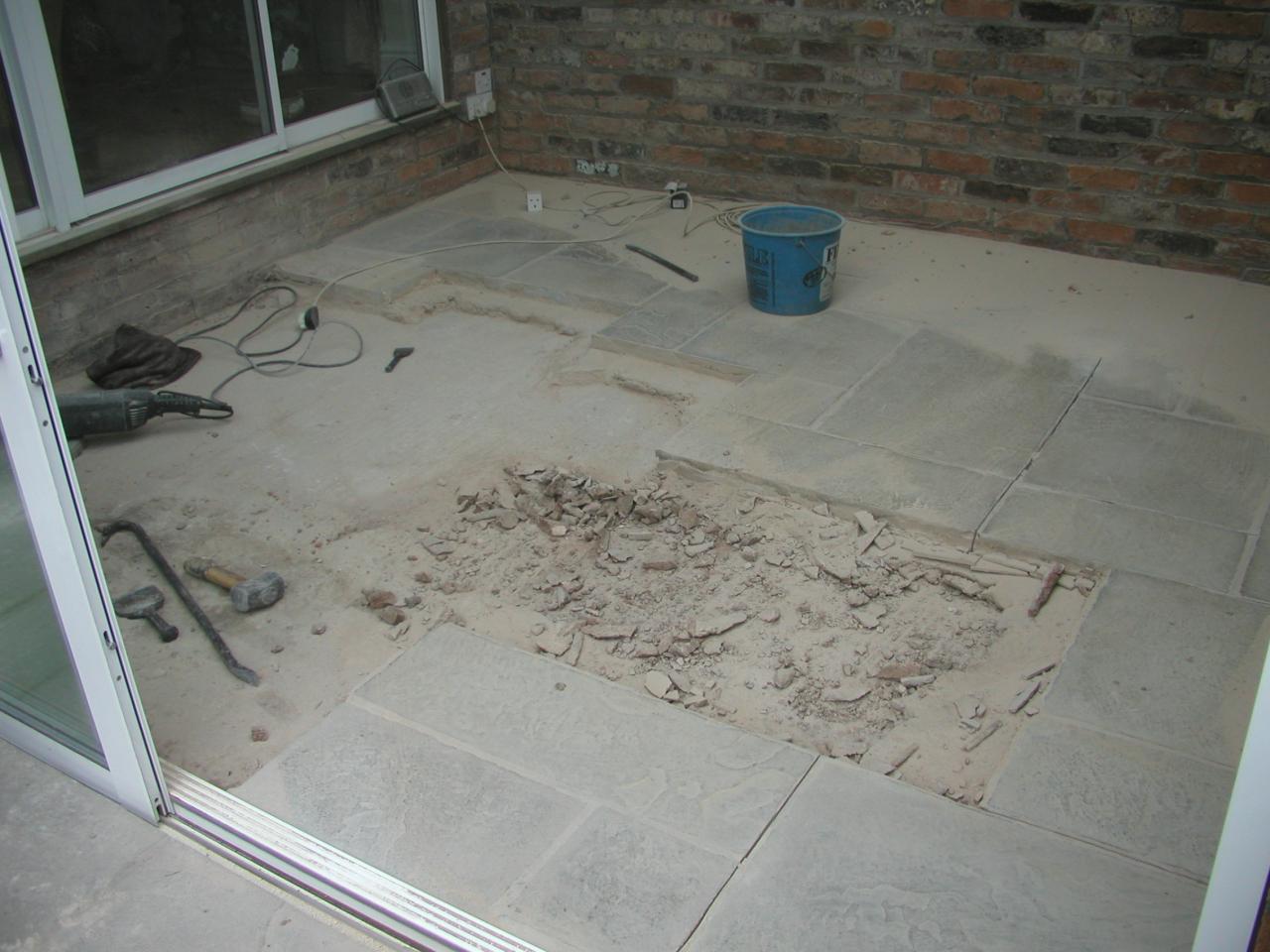 JPEG image - 4th Jan: At the end of day one of removing the concrete slabs: dust everywhere since I had to use the angle-grinder to cut out the mortar joints to get them up. ...